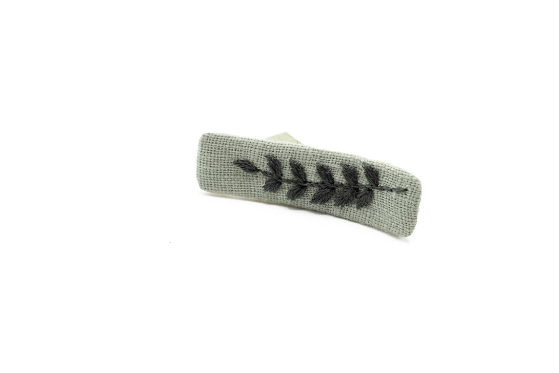 Eco-friendly dusty gray linen hair clip featuring a delicate hand-stitched leaf design, ideal for weddings, casual wear, and bridesmaid proposal gifts