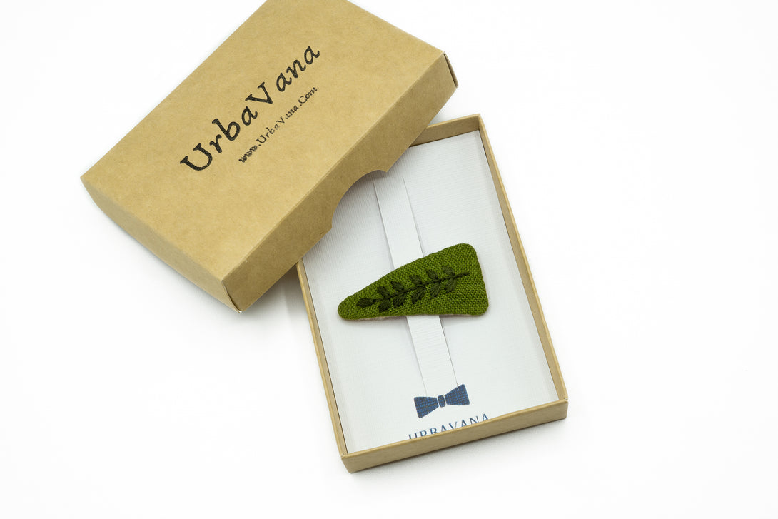 Moss green hand-embroidered hair clip with delicate leaf design, eco-friendly packaging by UrbaVana, sustainable hair accessory for everyday wear.