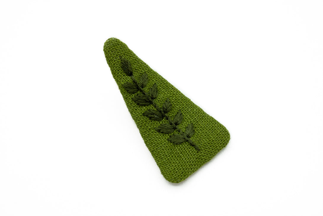 Handcrafted moss green fabric hair clip featuring embroidered leaves, beautifully packaged in an eco-conscious UrbaVana box, perfect for eco-friendly hair accessories.