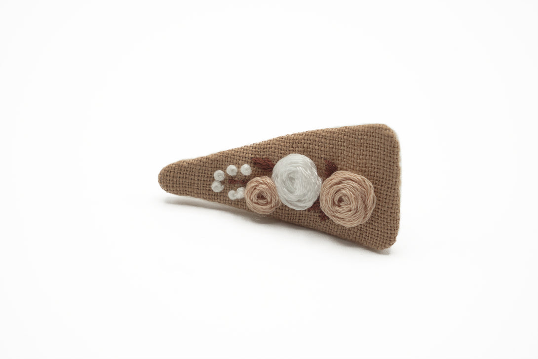 Eco-friendly taupe hair clip with Taupe and white embroidered flowers, handcrafted by UrbaVana, ideal for sustainable fashion and unique hair accessories