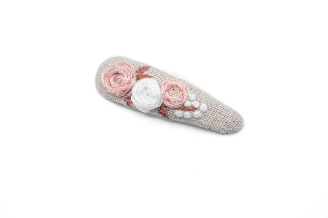 Bridesmaid proposal gift featuring a floral hand-embroidered dusty rose hair clip, delicately crafted with pink and white flowers, ideal for wedding accessories by UrbaVana.