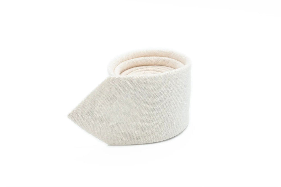 Ivory linen necktie for weddings, elegantly displayed in a neat fold – ideal for formal occasions and groomsmen attire