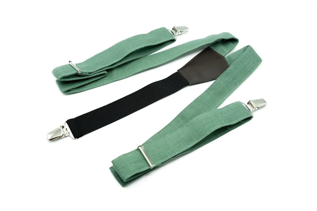 Stylish dark sage green Y-back suspenders with black elastic and silver clips, designed for a modern, polished look.