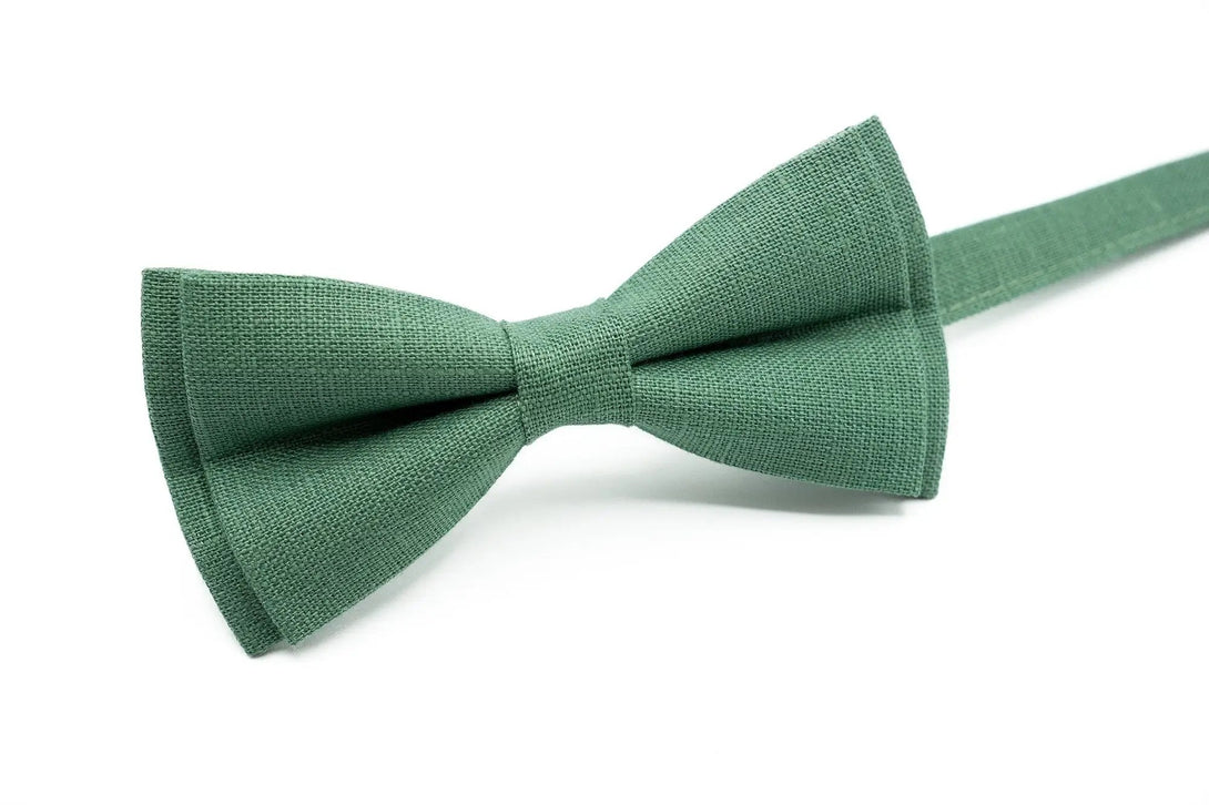 Sophisticated men's dark sage green linen bow tie, complete with a matching pocket square for elegant attire.