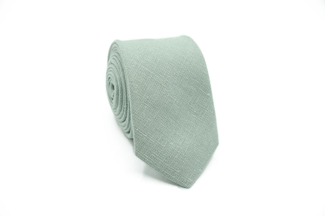 Dusty Sage Green linen wedding necktie for groomsmen in soft fabric.