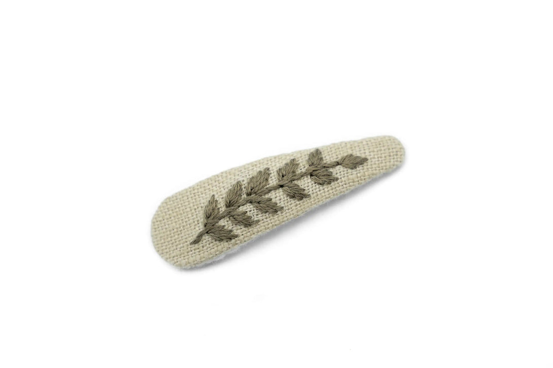 Handcrafted beige hair clip with floral embroidery, ideal for women and girls, eco-conscious packaging by UrbaVana, designed for stylish and sustainable hair accessories.