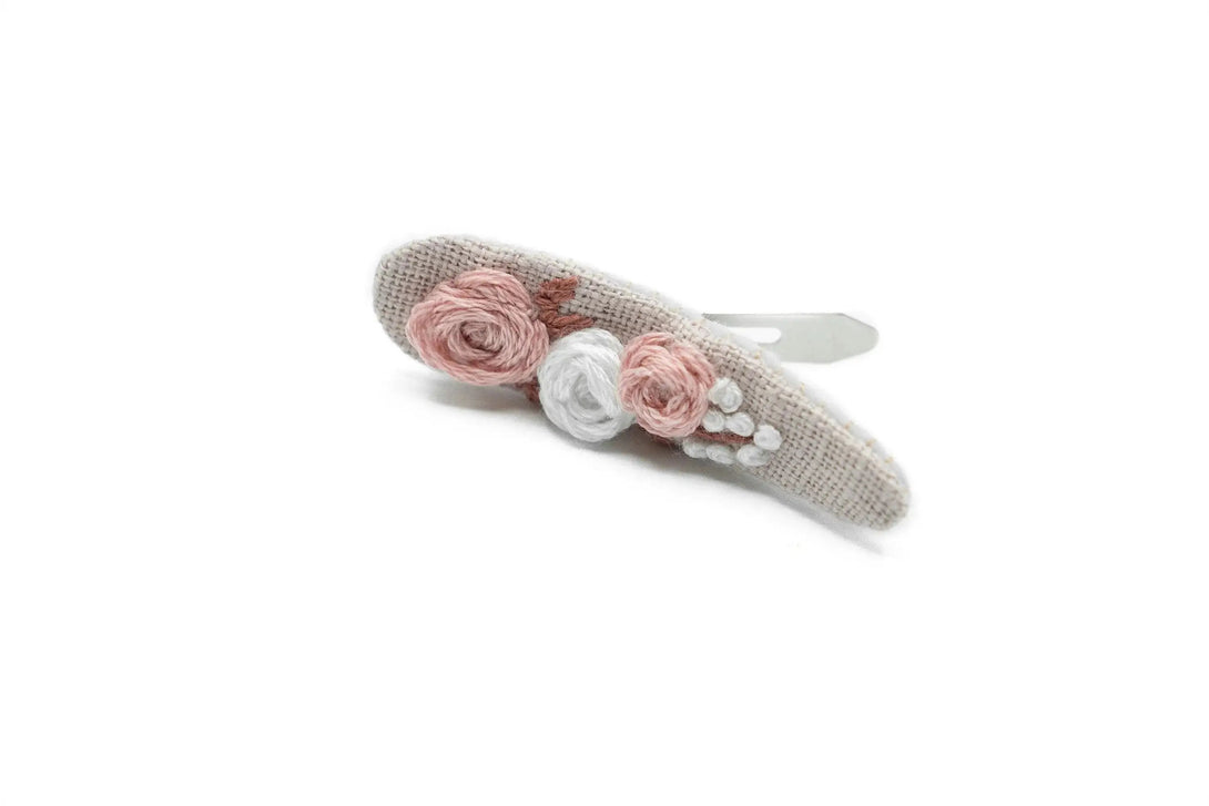 Floral hand-embroidered dusty rose hair clip, a perfect bridesmaid proposal gift, beautifully packaged by UrbaVana, ideal for weddings and special occasions.