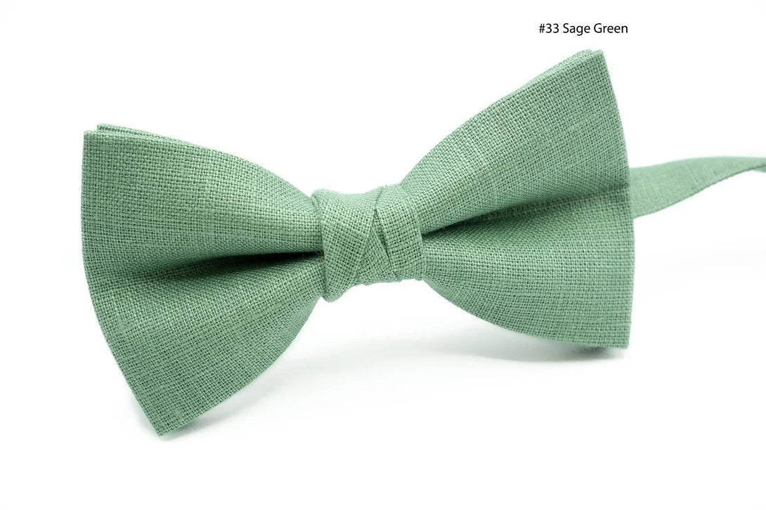 Father and son bow ties in assorted shades of sage green, ideal for special occasions.