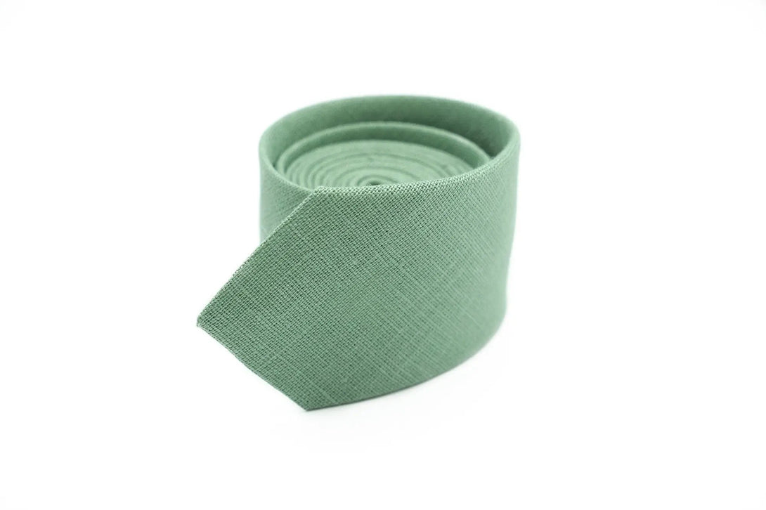 Slim Sage Green Necktie for Weddings – A slim sage green linen necktie, ideal for groomsmen or formal occasions, shown with a matching pocket square.