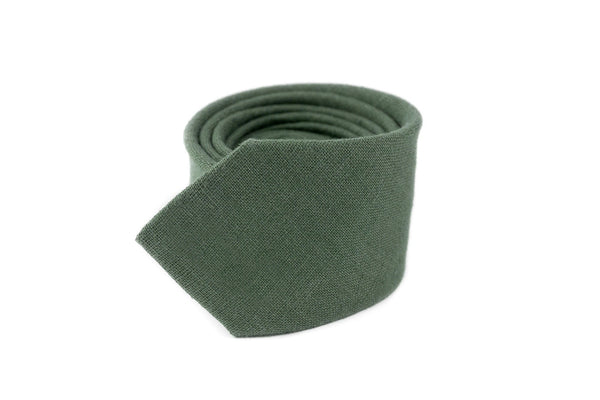 Pine green men's linen necktie, rolled up, showcasing its elegant fabric texture, ideal for weddings and formal events.