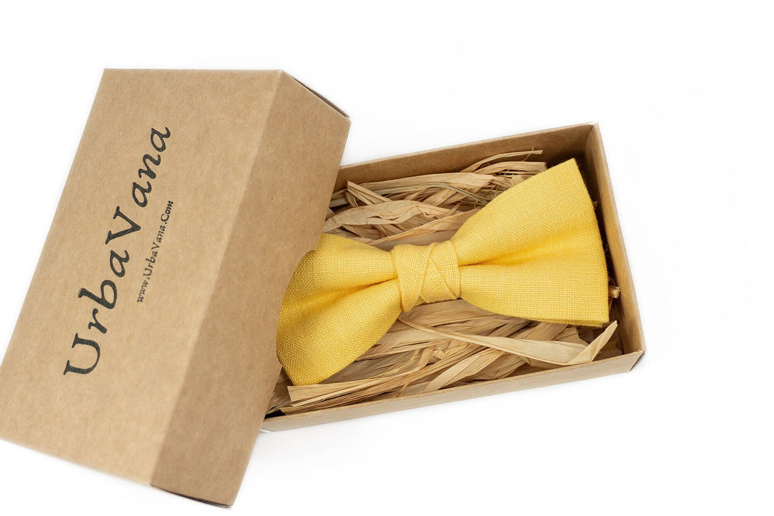 Yellow color pre-tied bow tie for groom or groomsmen on wedding day as unique gift from bride